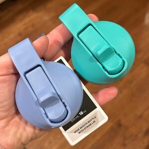 Two Hydroflask wide mouth lids